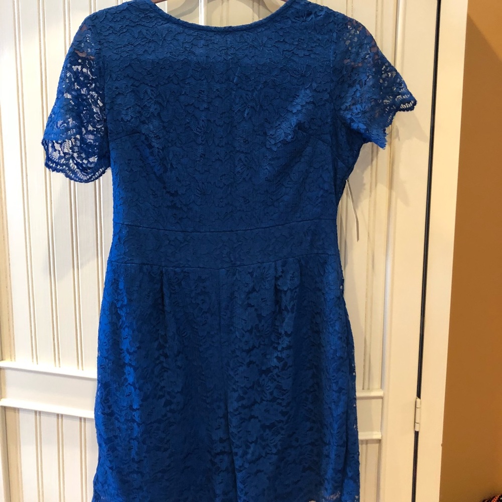 NEVER WORN w/tags. Blue laced romper.